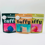 image of complete set of modern herb co 15 ct live d9 taffy bags, pictured left to right: (sour blue razz, birthday cake, orange creme)